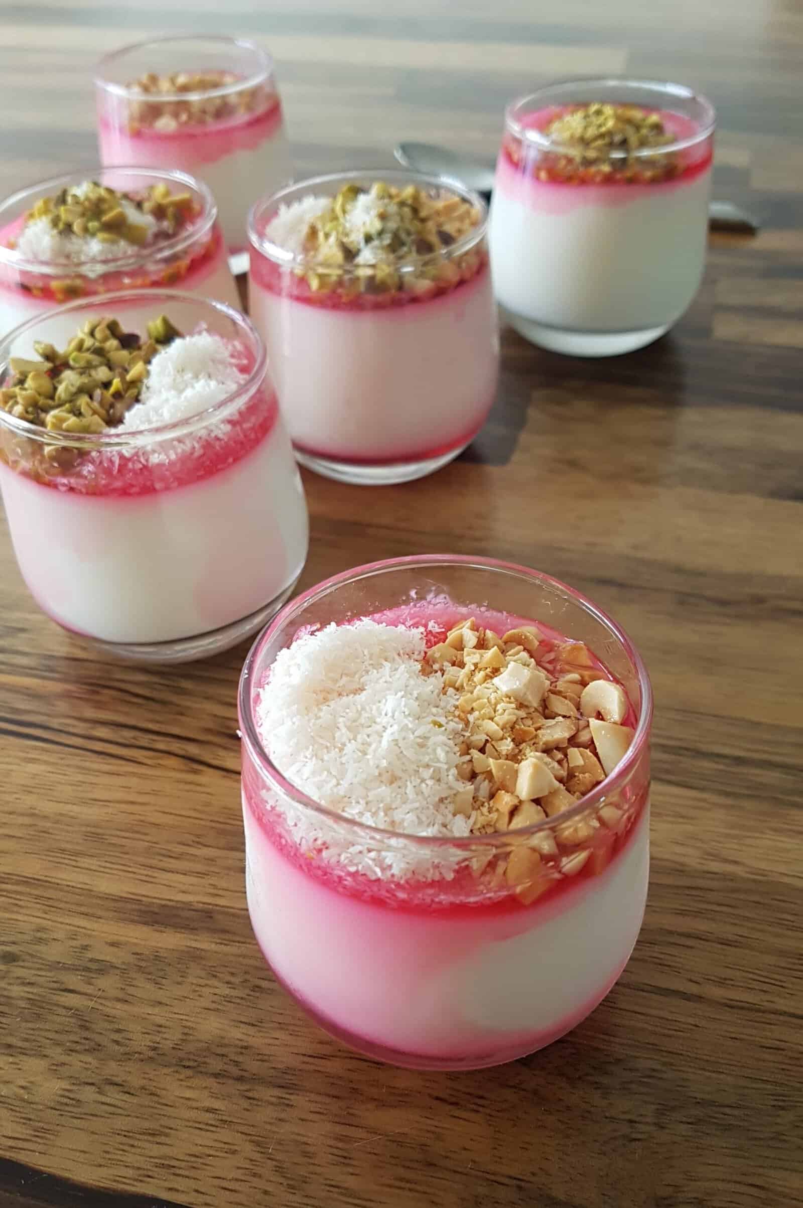 malabi dessert with coconut and red syrup