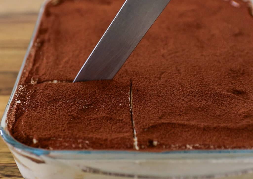 cutting into the tiramisu