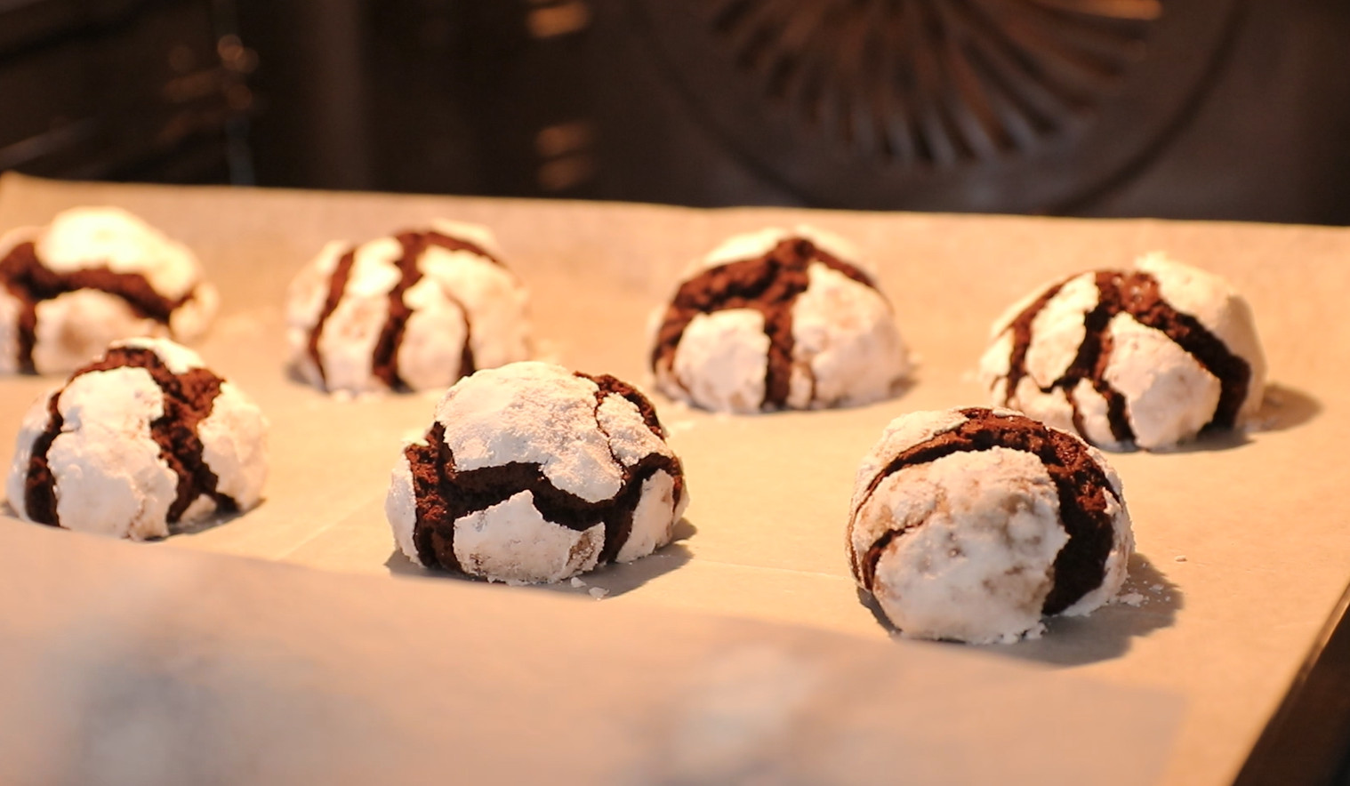 Bake chocolate crinkle cookies until the edges are firm, and the centers stay fudgy