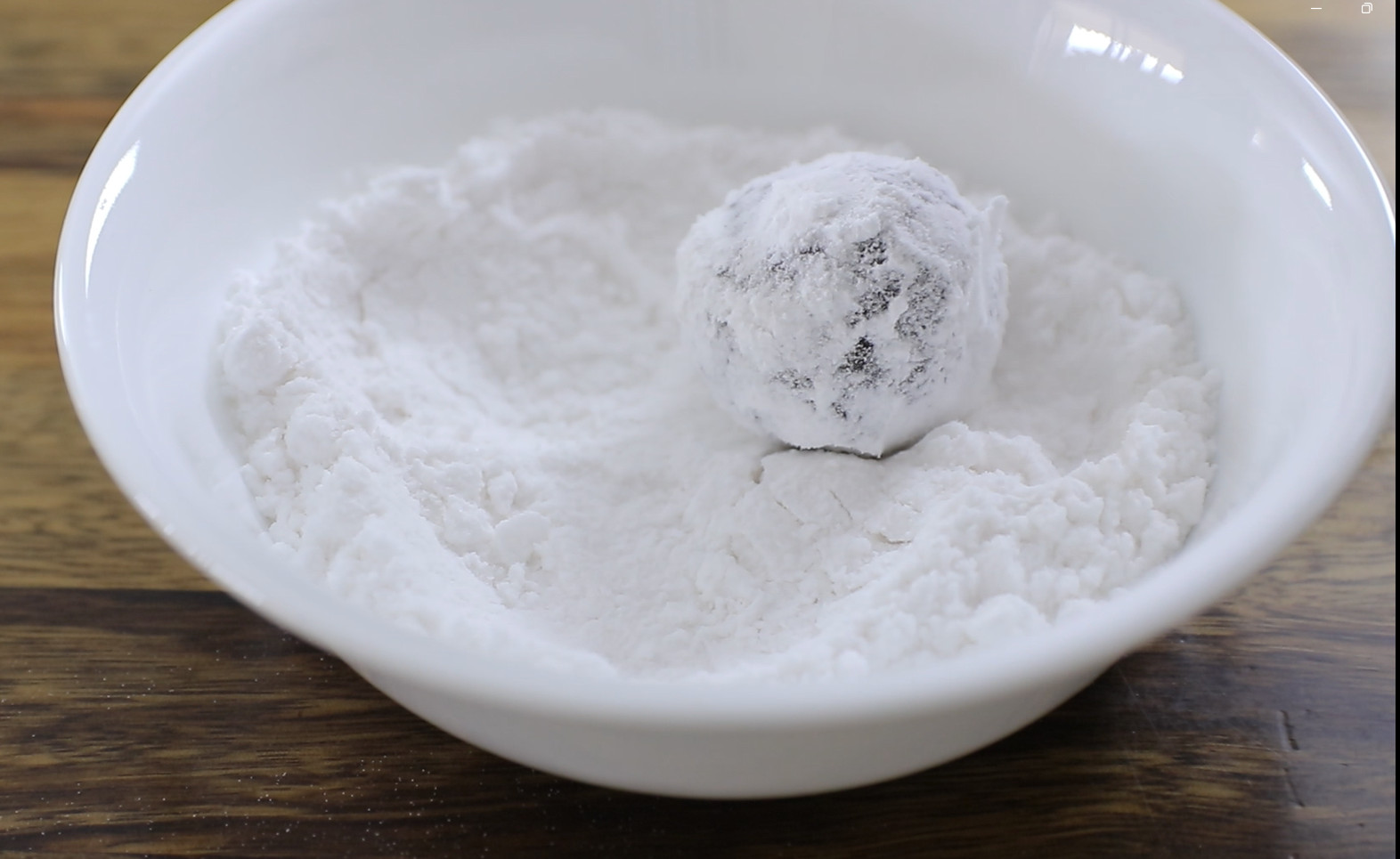 Shape into balls, then coat generously in powdered sugar