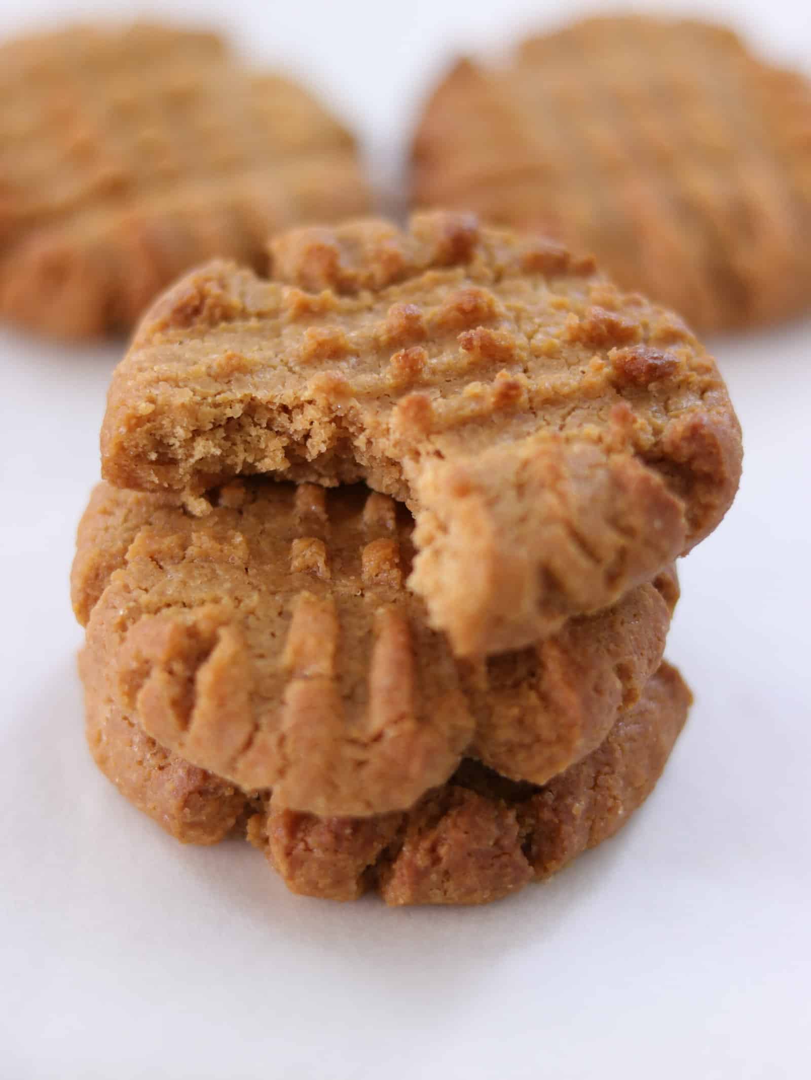 a snack of peanut butter cookies with one cookie that was bitten 