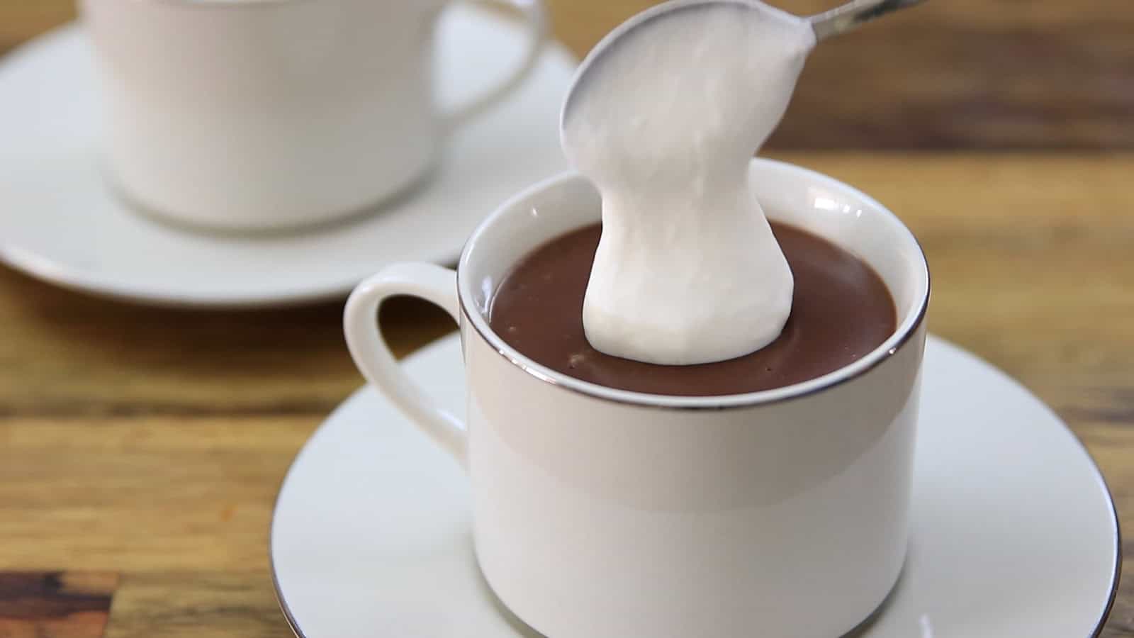 serving thick hot chocolate with homemade whipped cream