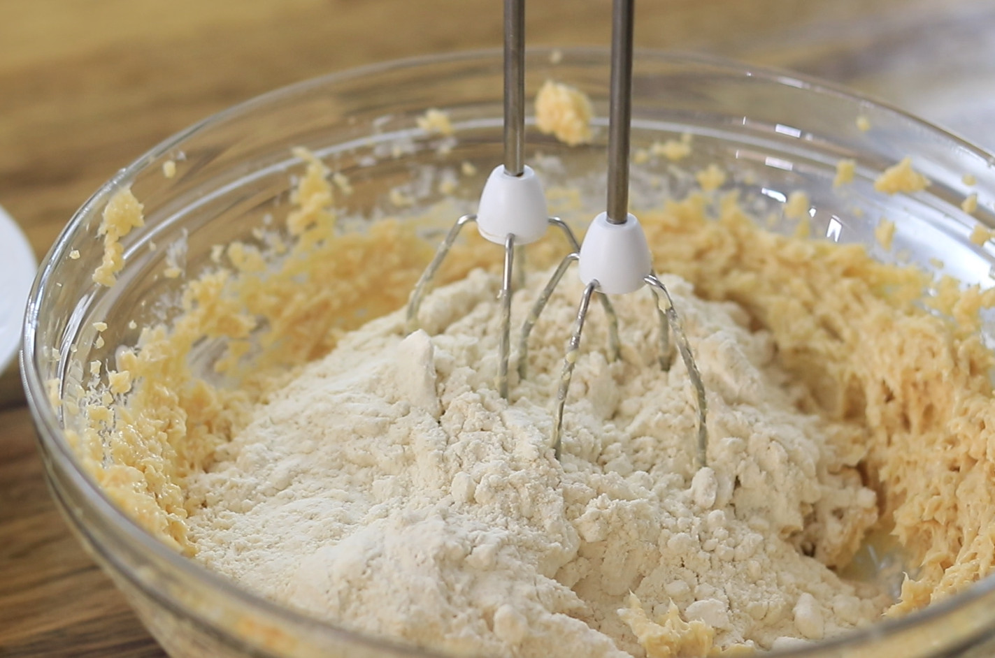 Add heat-treated flour and stir until combined, then fold in chocolate chips.