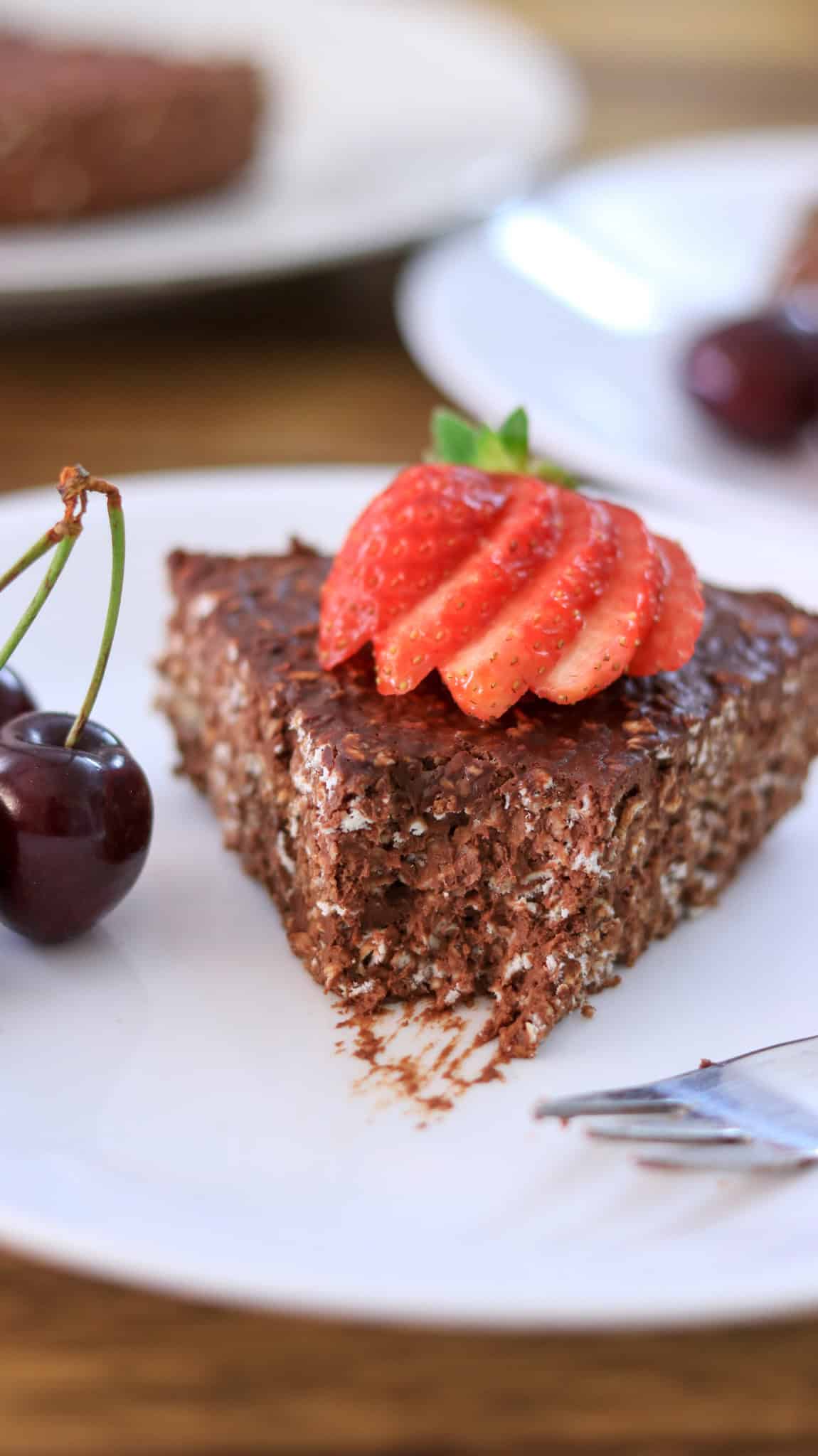 A bitten piece of chocolate oatmeal cake