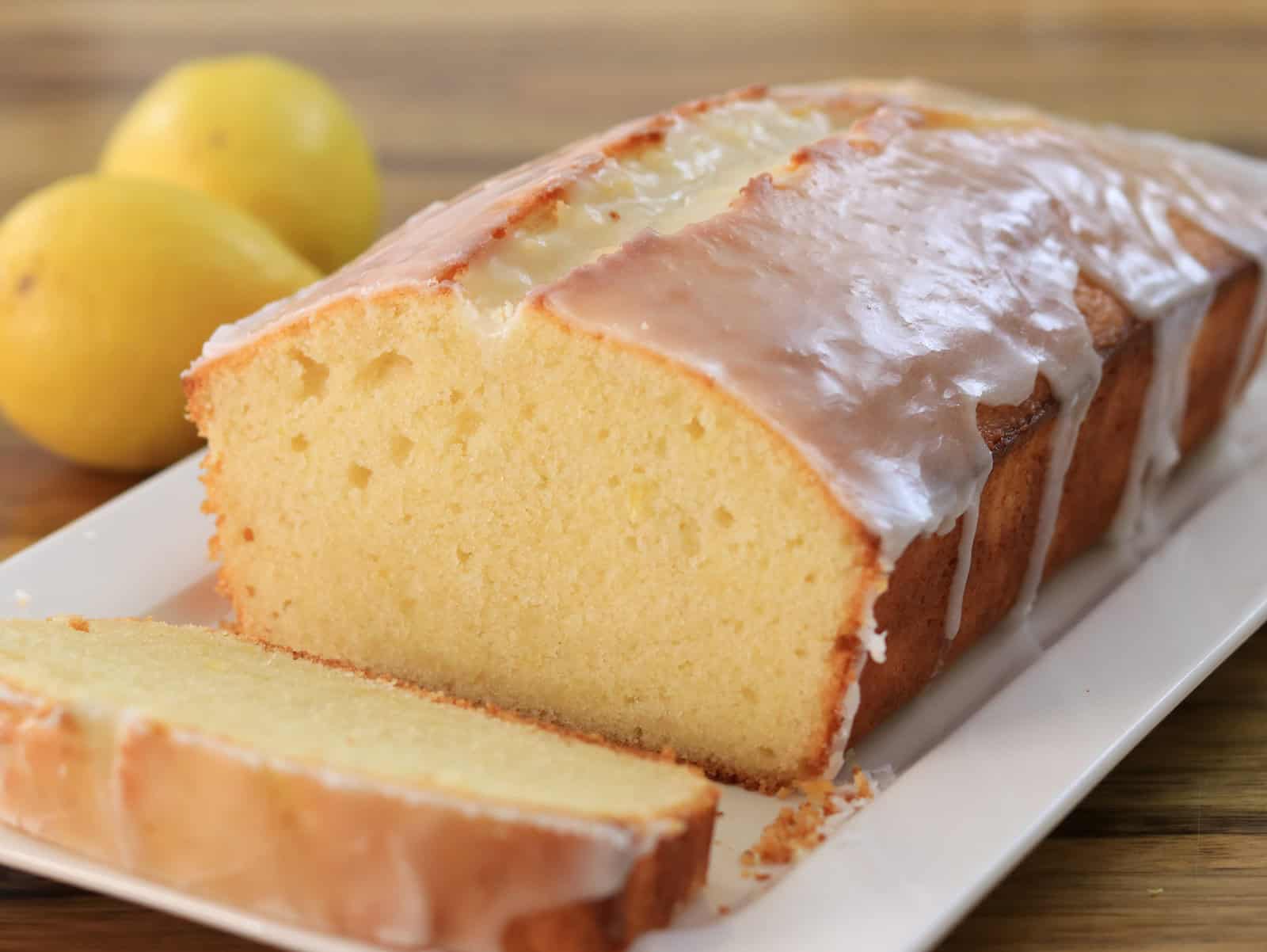 lemon pound cake with a drizzle of lemon glaze on top