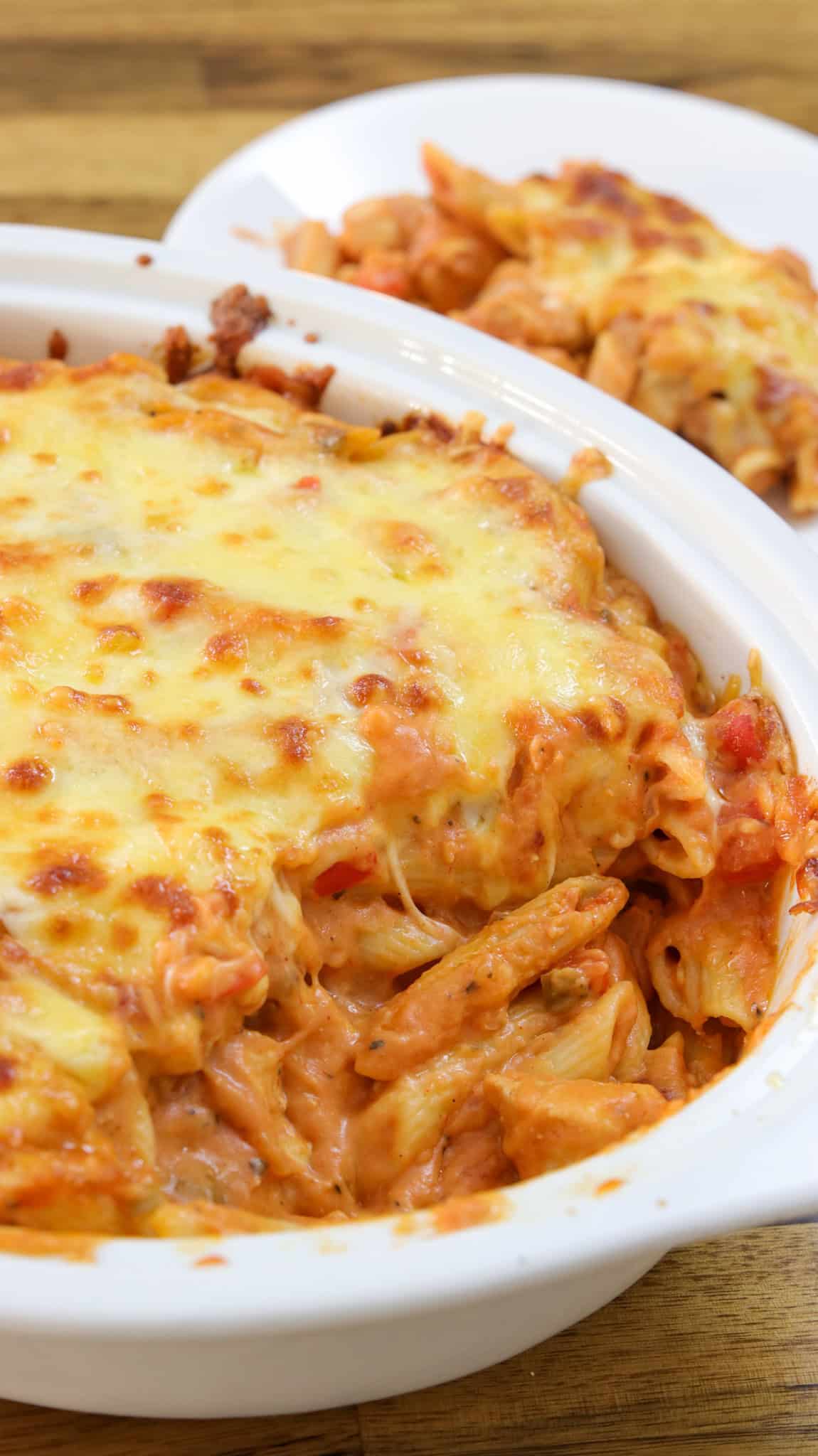 chicken pasta bake in a white casserole dish