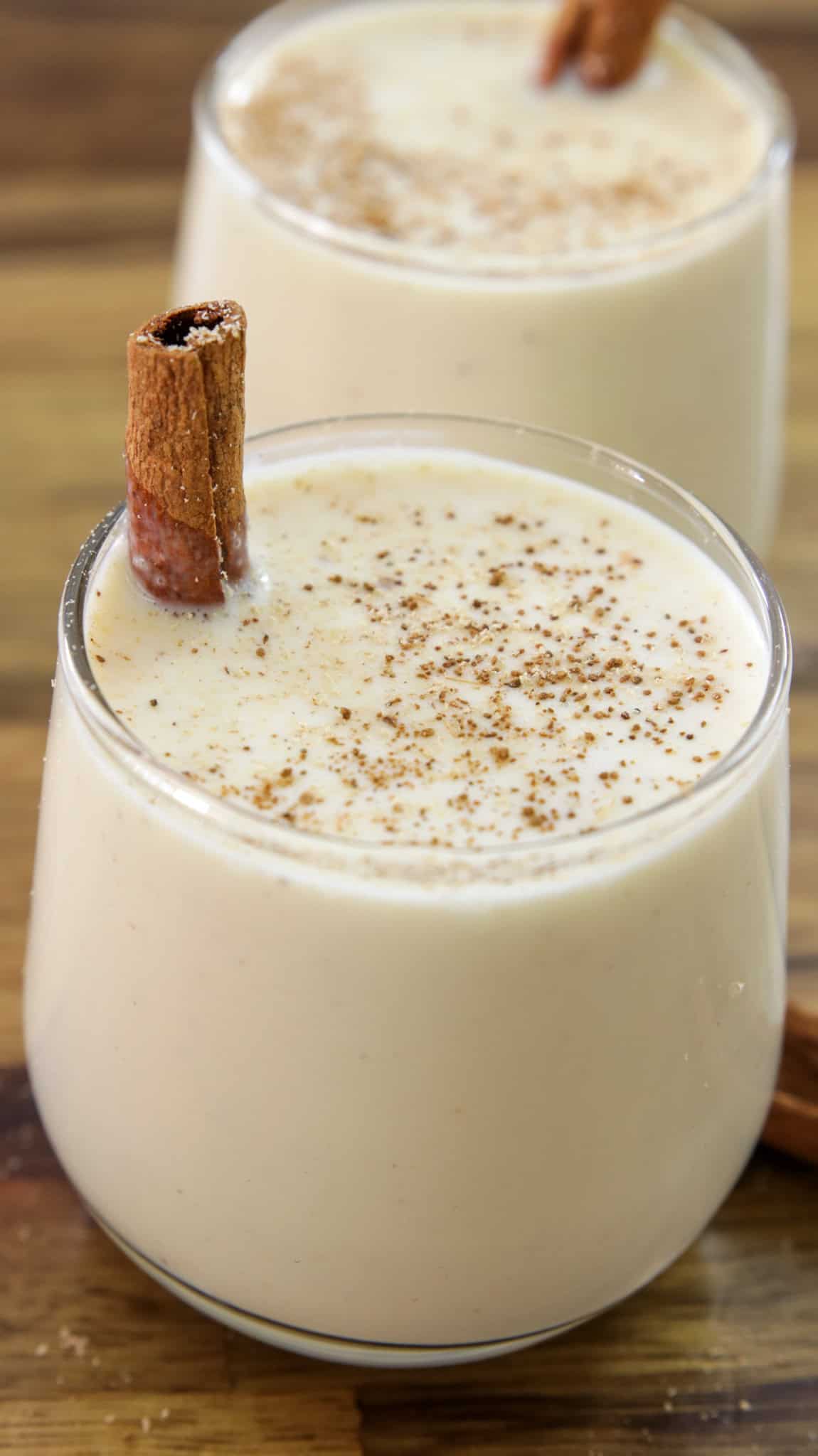 homemade eggnog with a cinnamon stick