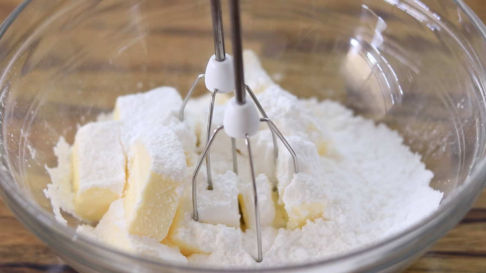 Mixing butter and powdered sugar