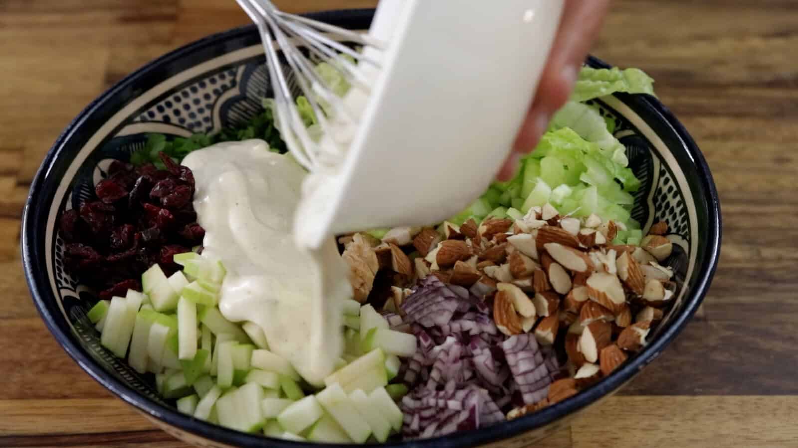 pouring chicken salad dressing