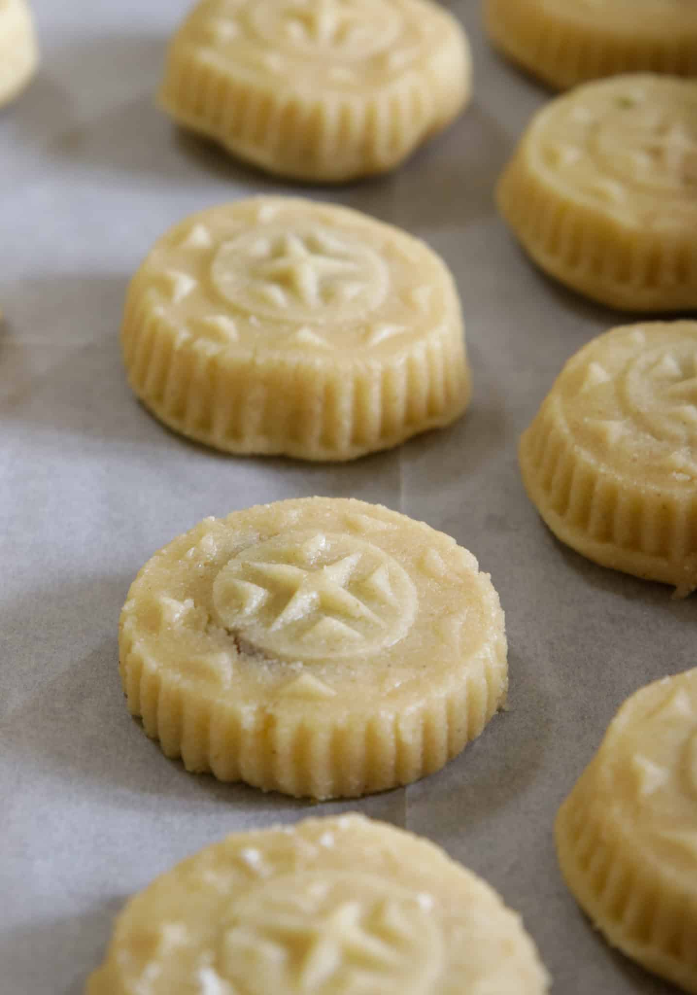 unbaked shaped maamoul cookies on a baking tray