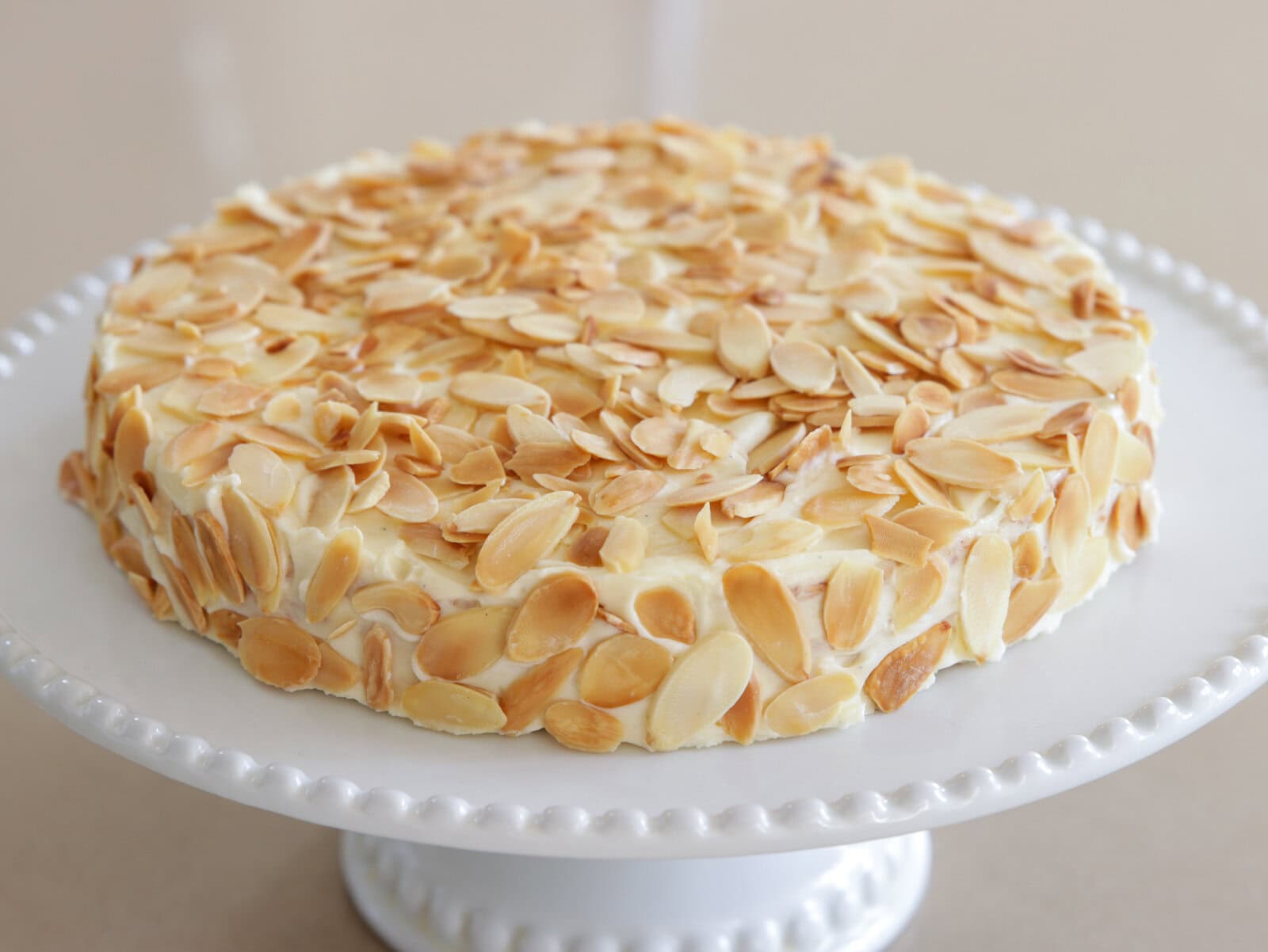 Swedish almond cake decorated with toasted sliced almonds