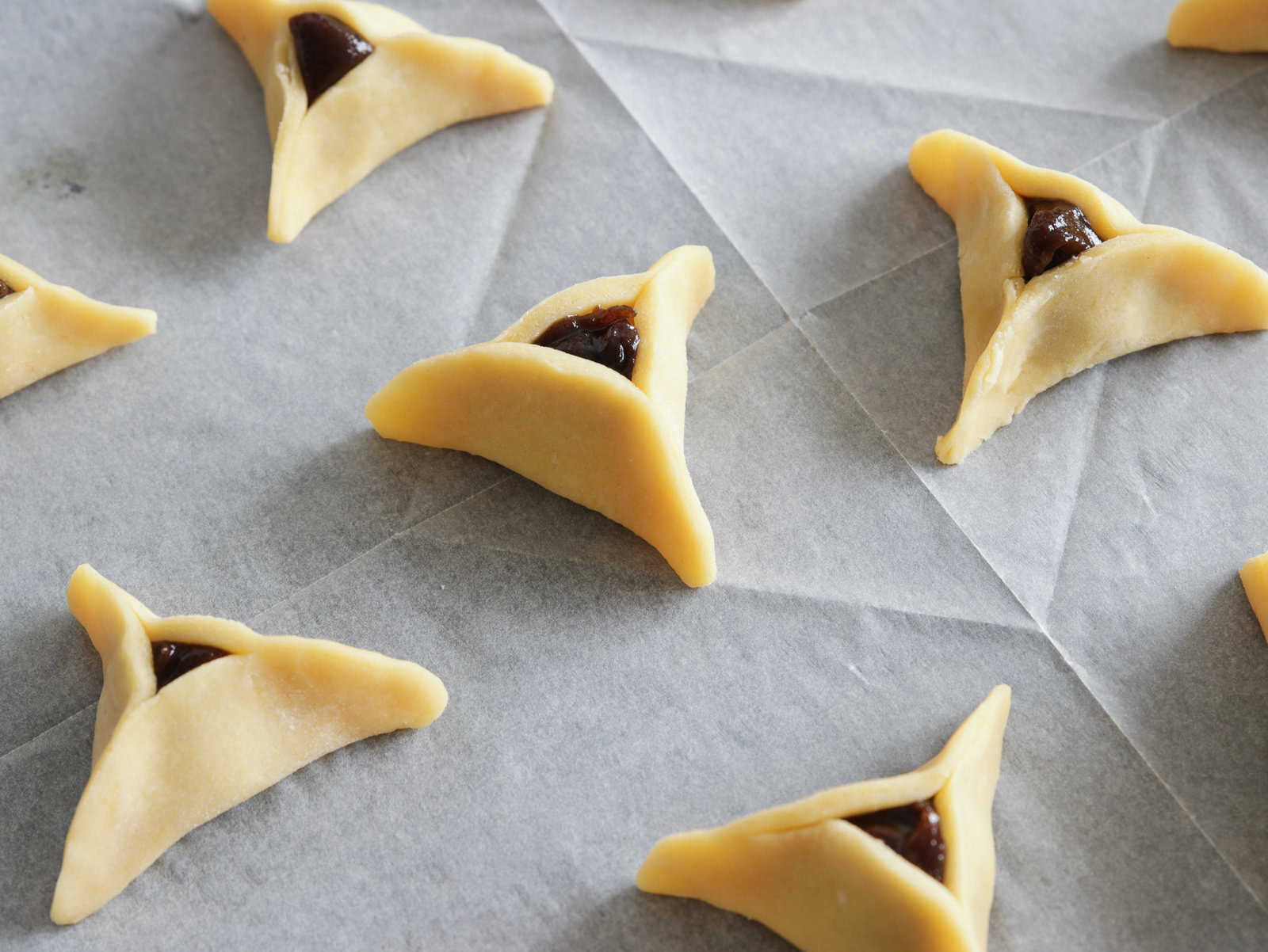 Hamantaschen buttery dough filled with date paste