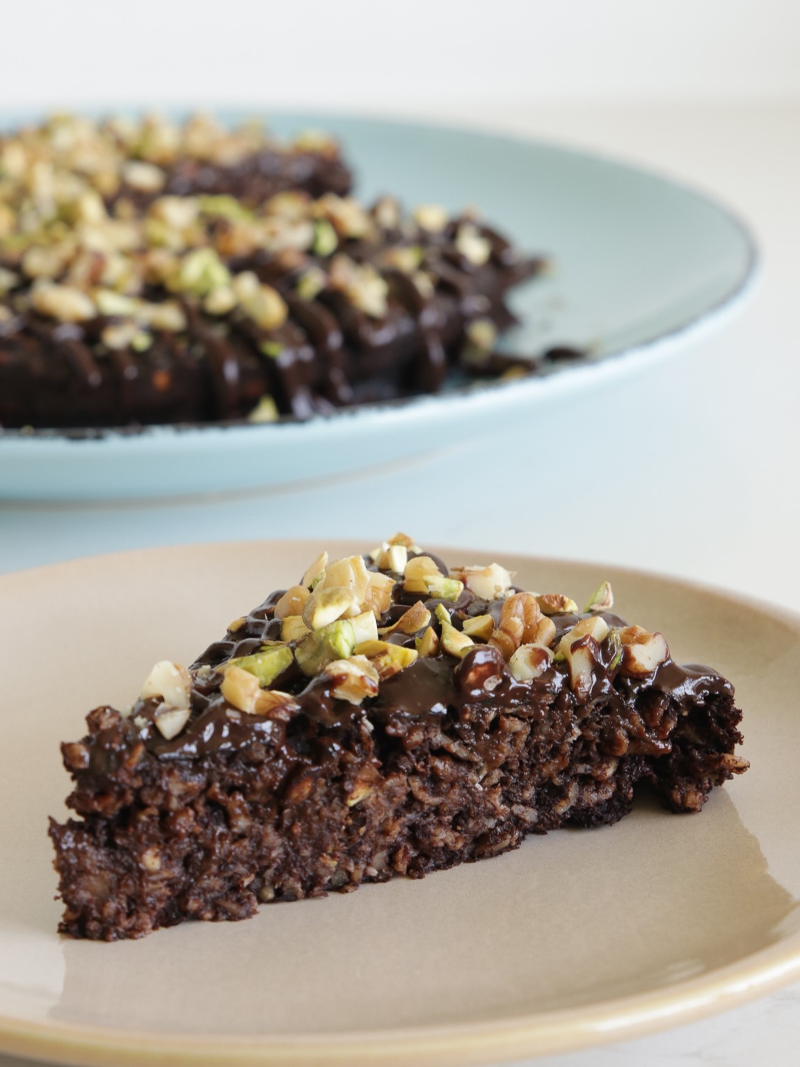 Banana Chocolate Oatmeal Cake with Nuts and a drizzle of dark chocolate on top