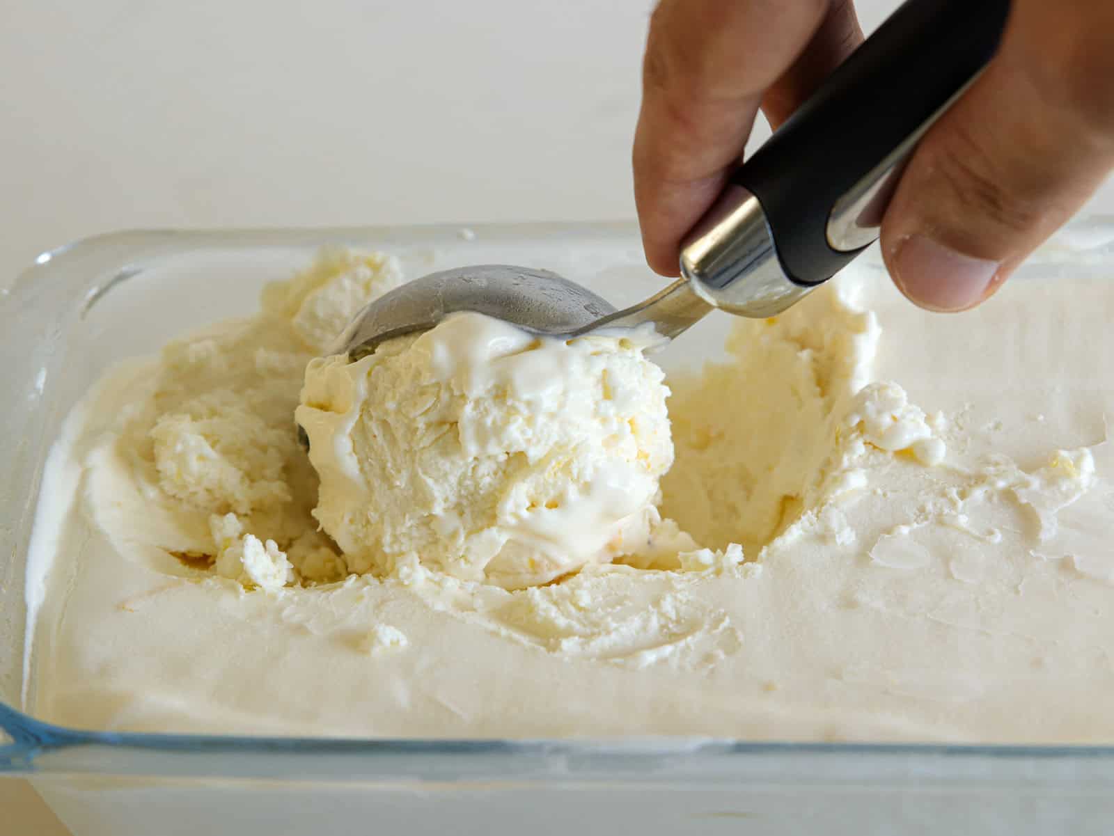 scooping a portion f lemon ice cream