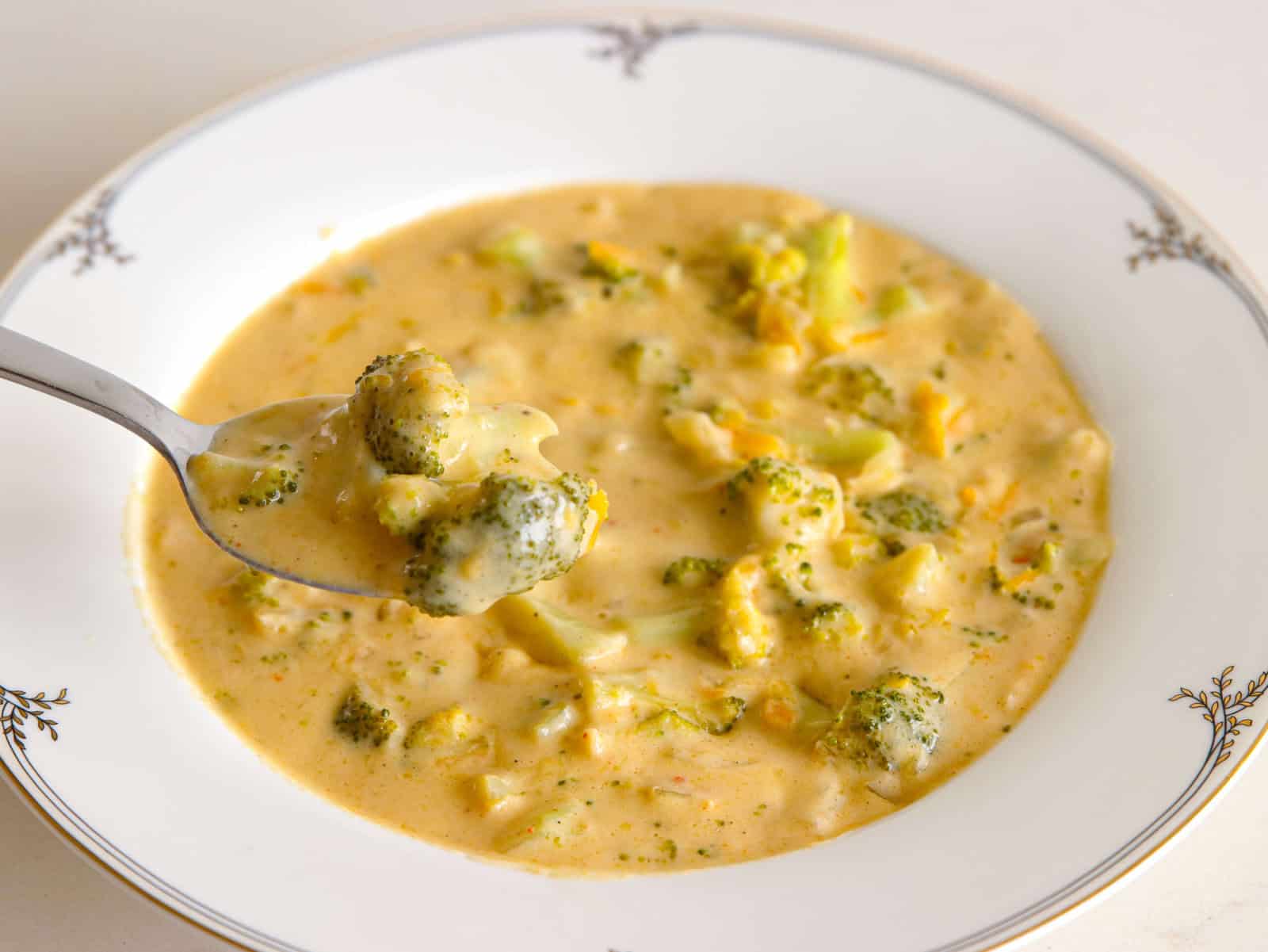 a spoon of broccoli cheddar soup