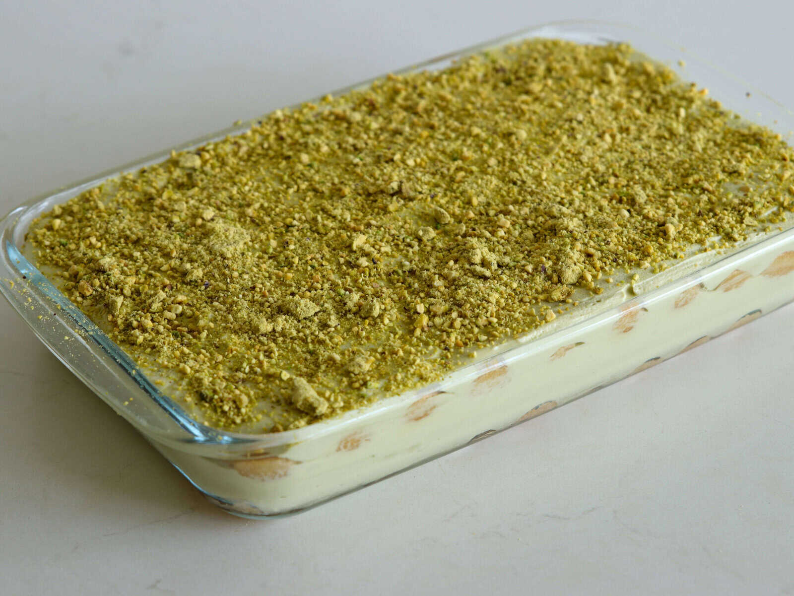 pistachio tiramisu topped with crushed pistachios 