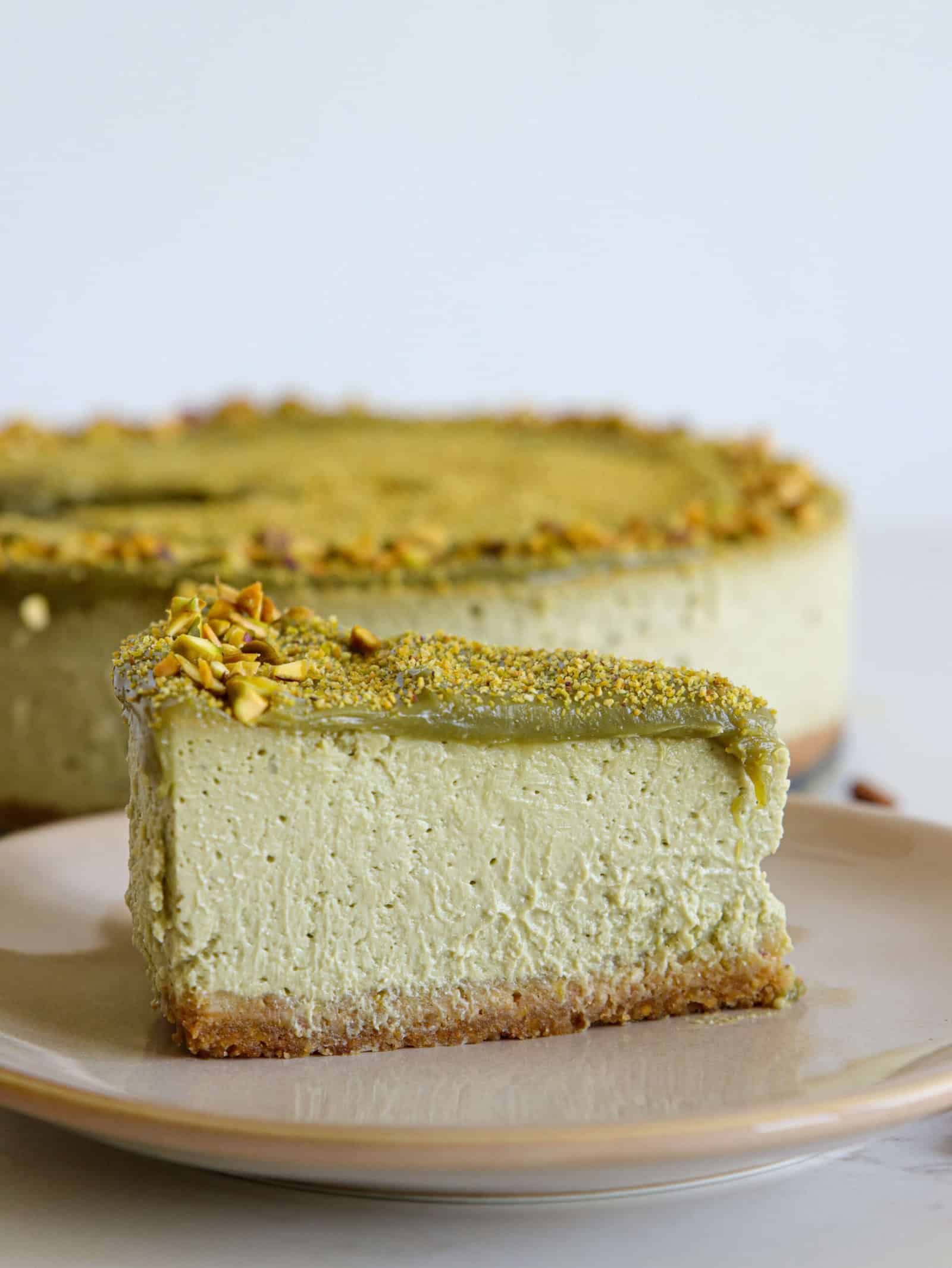 a slice of creamy pistachio cheesecake 