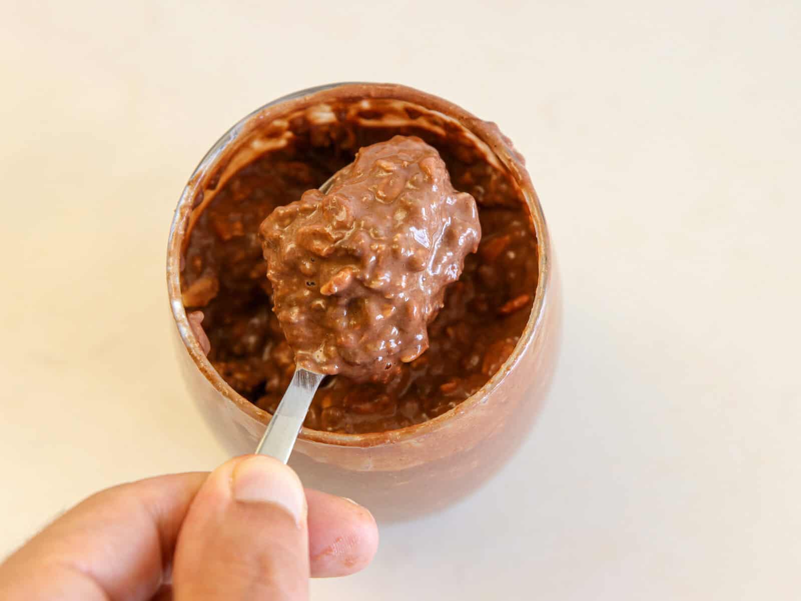 a spoon of Ferrero rocher overnight oats