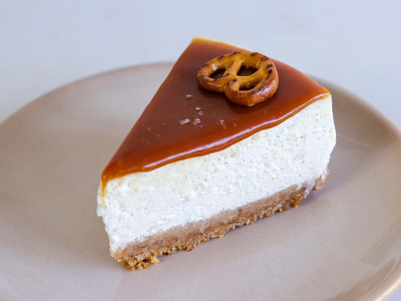 a slice of creamy and delicious salted caramel cheesecake