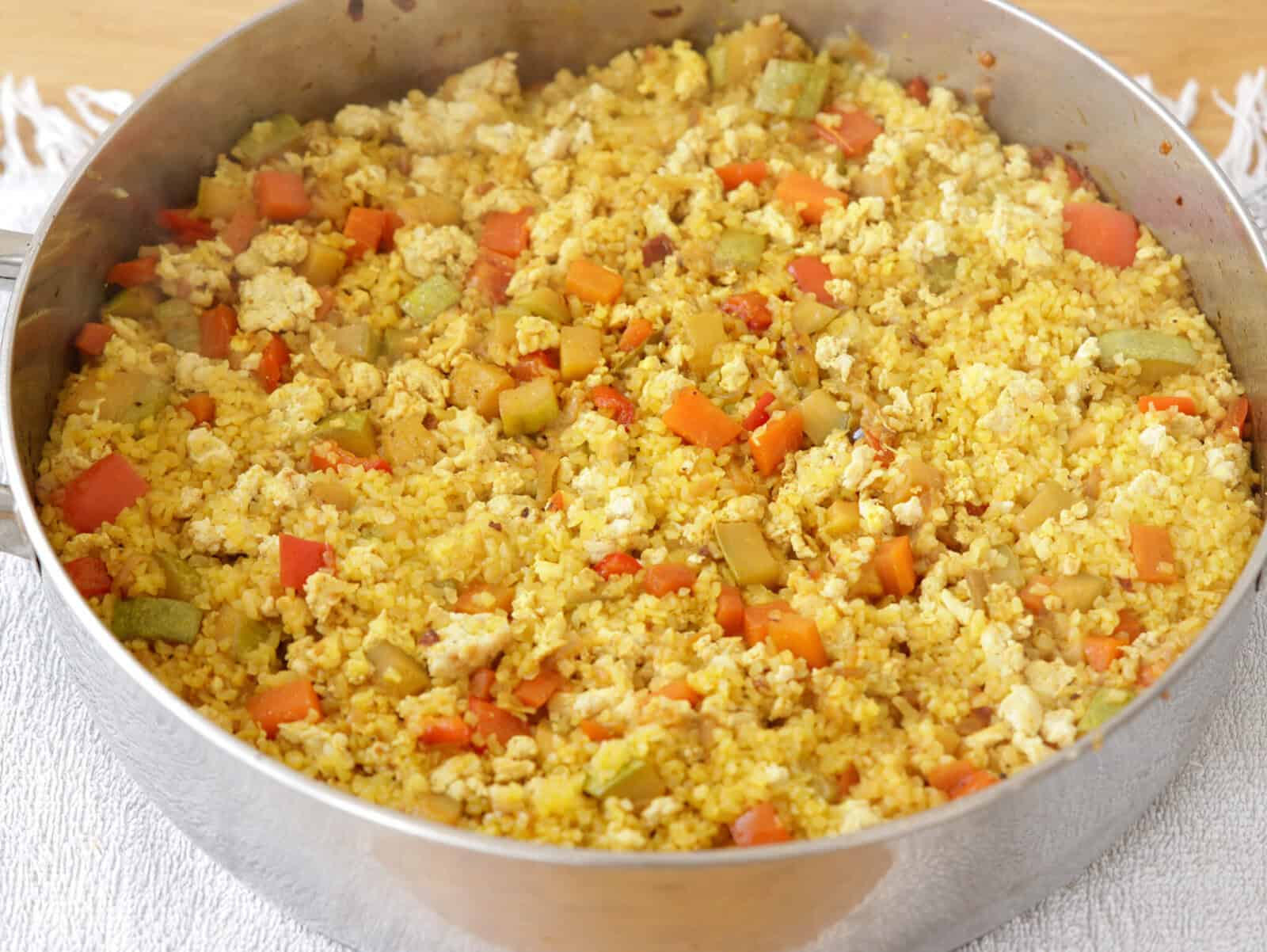 one pot filled with chicken quinoa and vegetables 