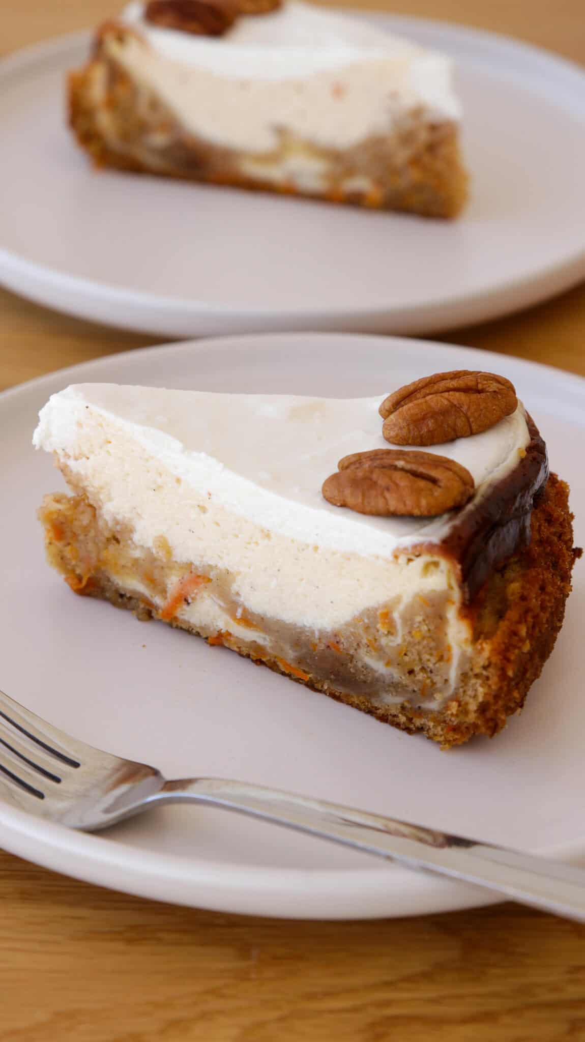 two slices of carrot cake cheesecake