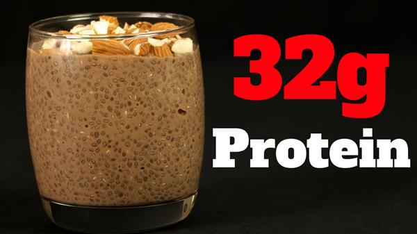 A glass filled with chocolate chia pudding topped with chopped almonds is set against a black background. The text "32g Protein" is written in bold red and white characters to the right of the glass.