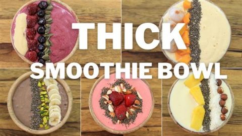 Five colorful smoothie bowls with various fruit and seed toppings are arranged in a grid. The center of the image features large, bold text that reads "THICK SMOOTHIE BOWL." The wooden background contrasts with the vibrant bowls.