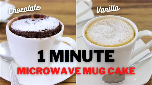 Two white mugs are shown on a wooden table, each containing a mug cake. The left mug holds a chocolate cake labeled "Chocolate," and the right mug holds a vanilla cake labeled "Vanilla." Below the mugs, text reads "1 MINUTE MICROWAVE MUG CAKE." A spoon is placed beside each mug.