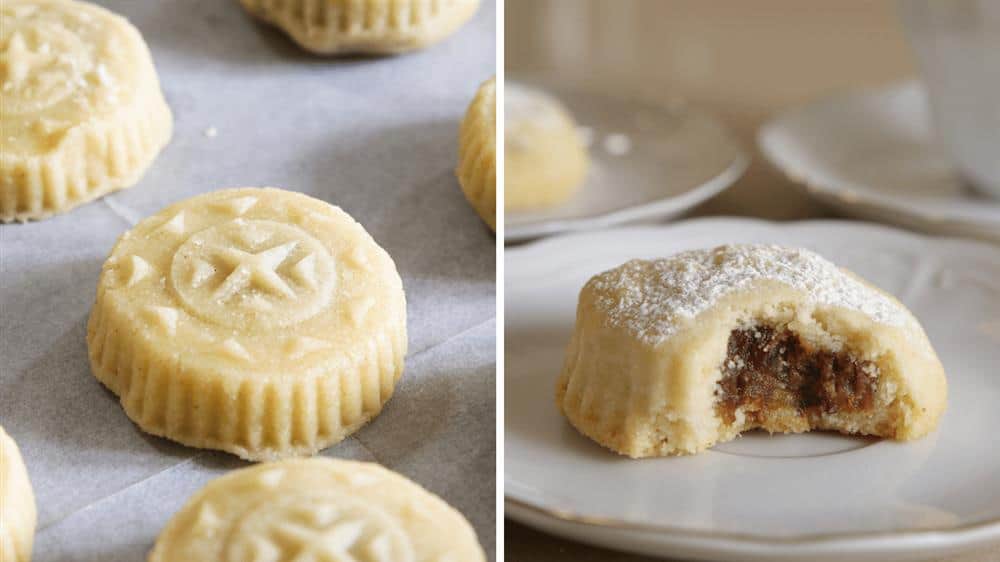 Left side: Several round, intricately patterned cookies on parchment paper. Right side: One of the same cookies on a plate, broken in half to reveal a filling of dates or nuts, with powdered sugar dusting on top.