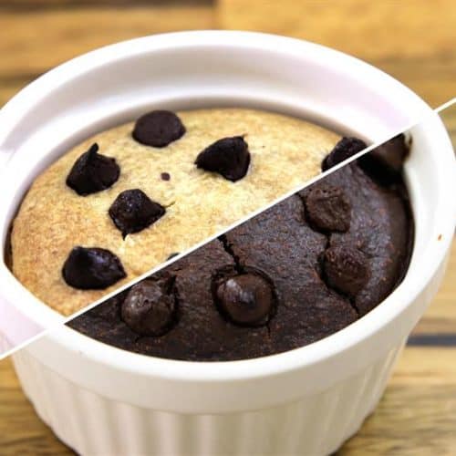 A white ceramic ramekin holds a half-and-half baked dessert, divided diagonally. The left half is a vanilla cake topped with chocolate chips, and the right half is a chocolate cake also topped with chocolate chips. The background is a wooden surface.