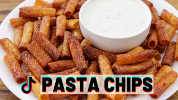 A plate of golden-brown pasta chips surrounds a small bowl of creamy white dip. The text "PASTA CHIPS" in bold letters with a colorful TikTok logo is overlaid at the bottom of the image.