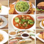 A collage of nine vegan dishes on a wooden table. Includes a veggie burger, guacamole with chips, a beet burger, hummus, zucchini soup, onion rings, noodle stir-fry, spring rolls with dipping sauces, and samosas with chutneys.