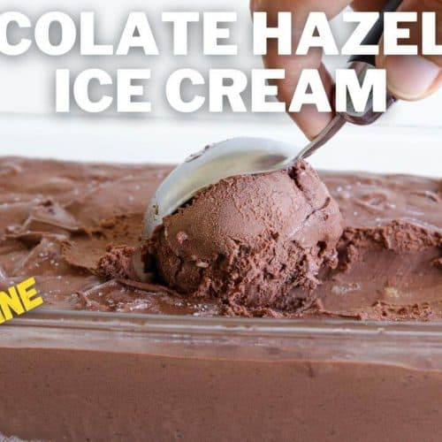 A close-up of a hand using an ice cream scoop to serve chocolate hazelnut ice cream from a glass container. The text "CHOCOLATE HAZELNUT ICE CREAM" is at the top in large, white letters, and "NO MACHINE" is in yellow text at the bottom left corner.