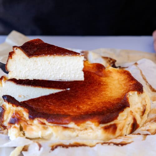 the cooking foodie slicing a piece of Basque cheesecake