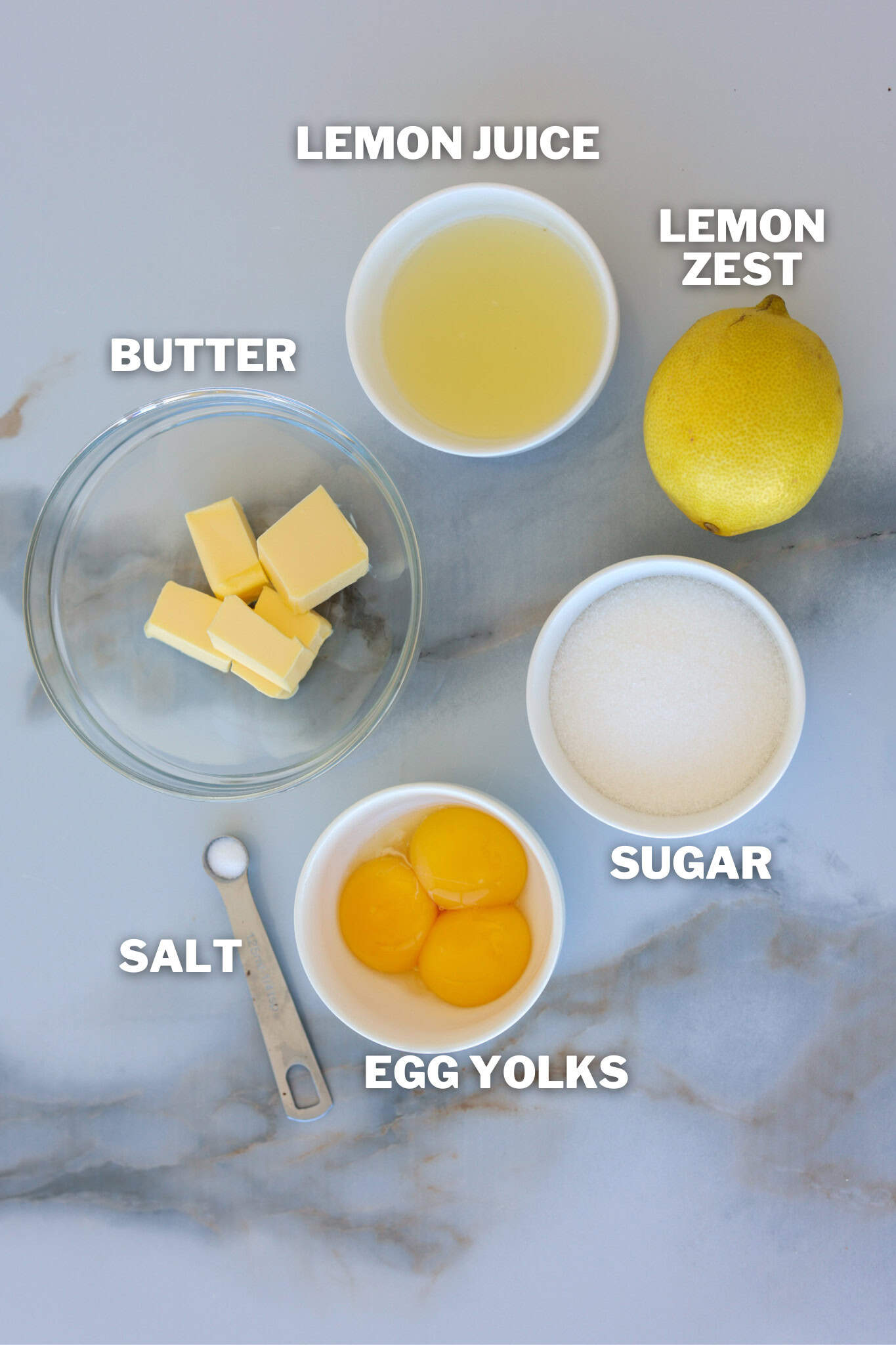 lemon curd ingredients: butter, lemon juice, lemon zest, sugar, egg yolks