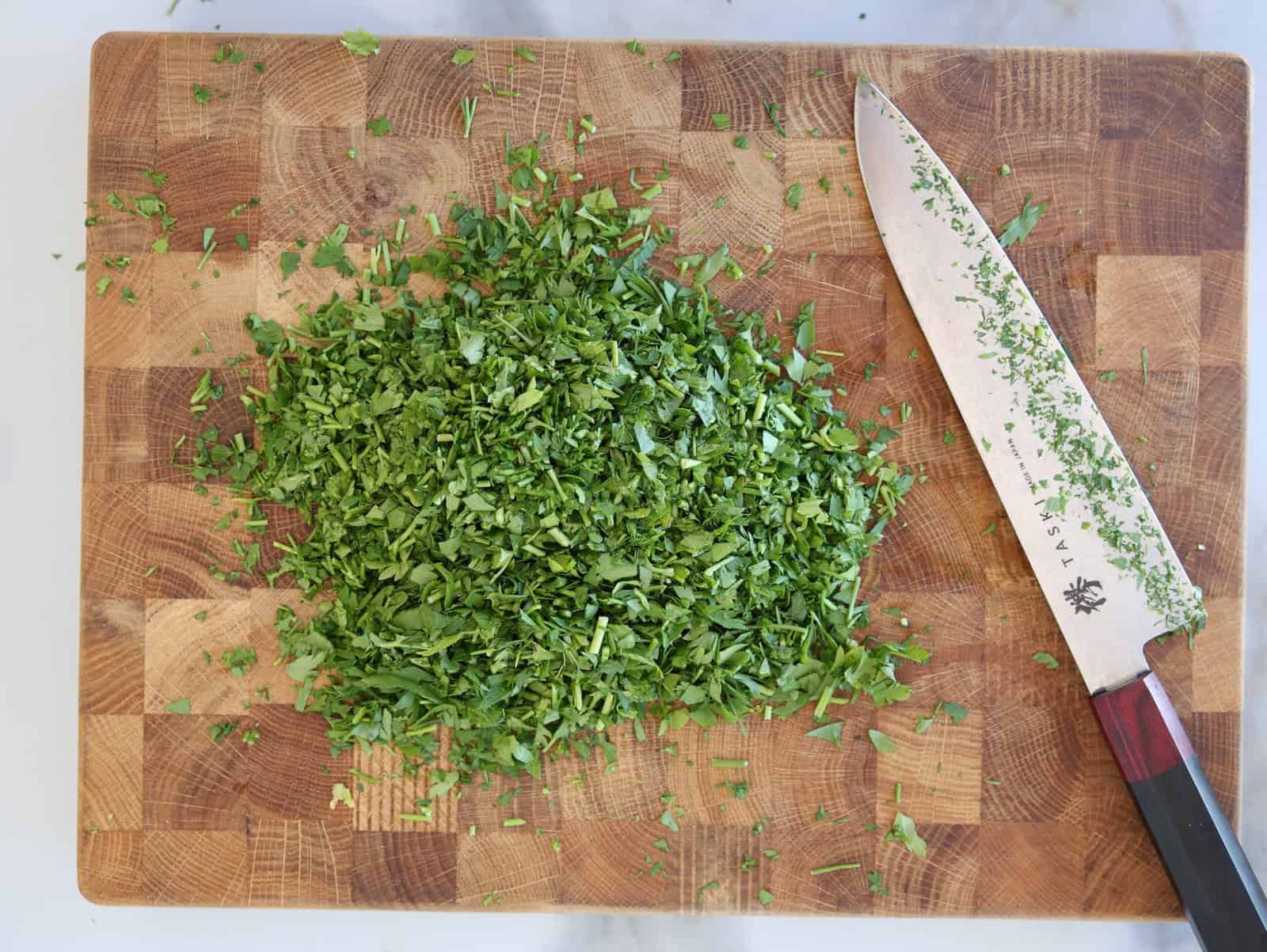 chopped parsley on a cutting board