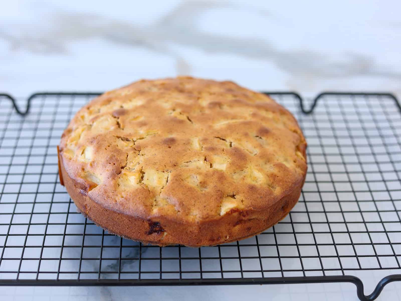 apple cake on a wire rack