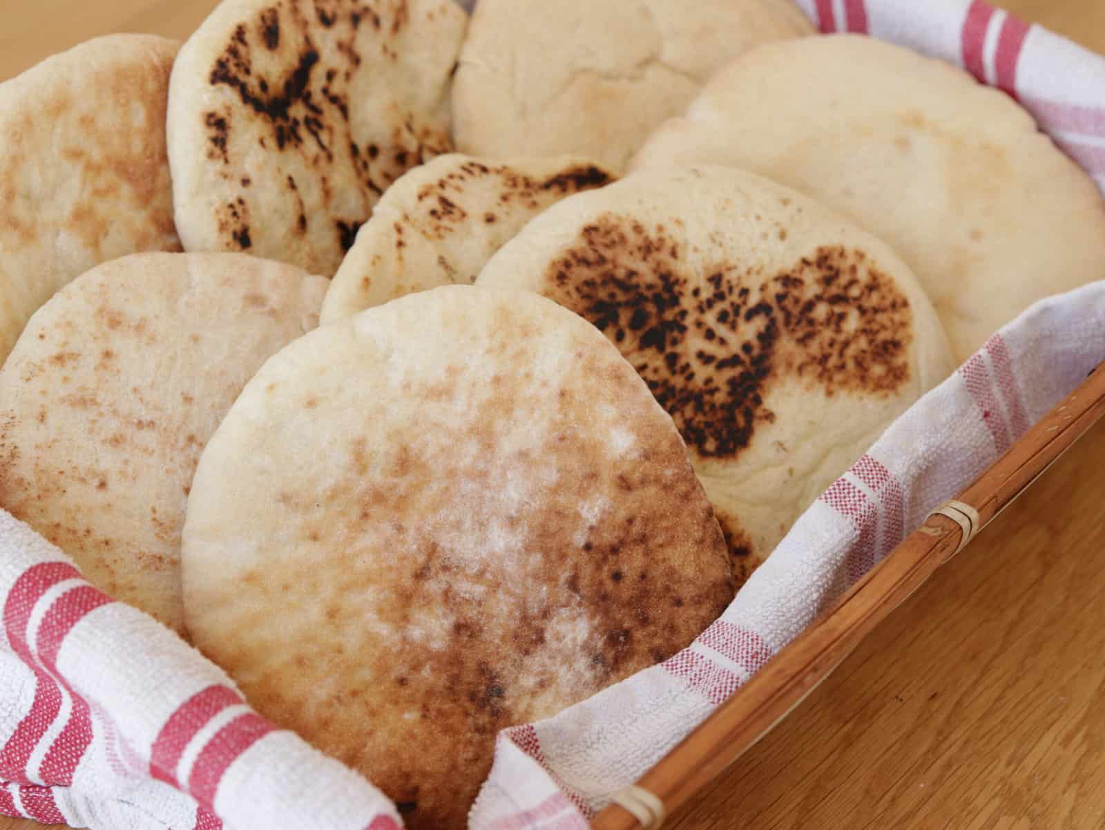 freshly baked homemade pita bread in a basket