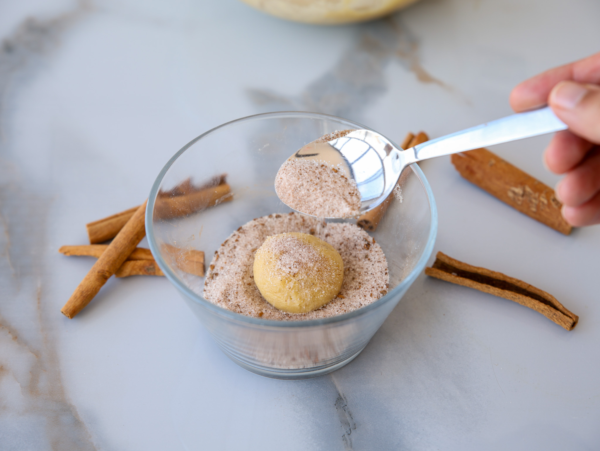 Roll dough balls in a cinnamon-sugar mix for the classic Snickerdoodle flavor.