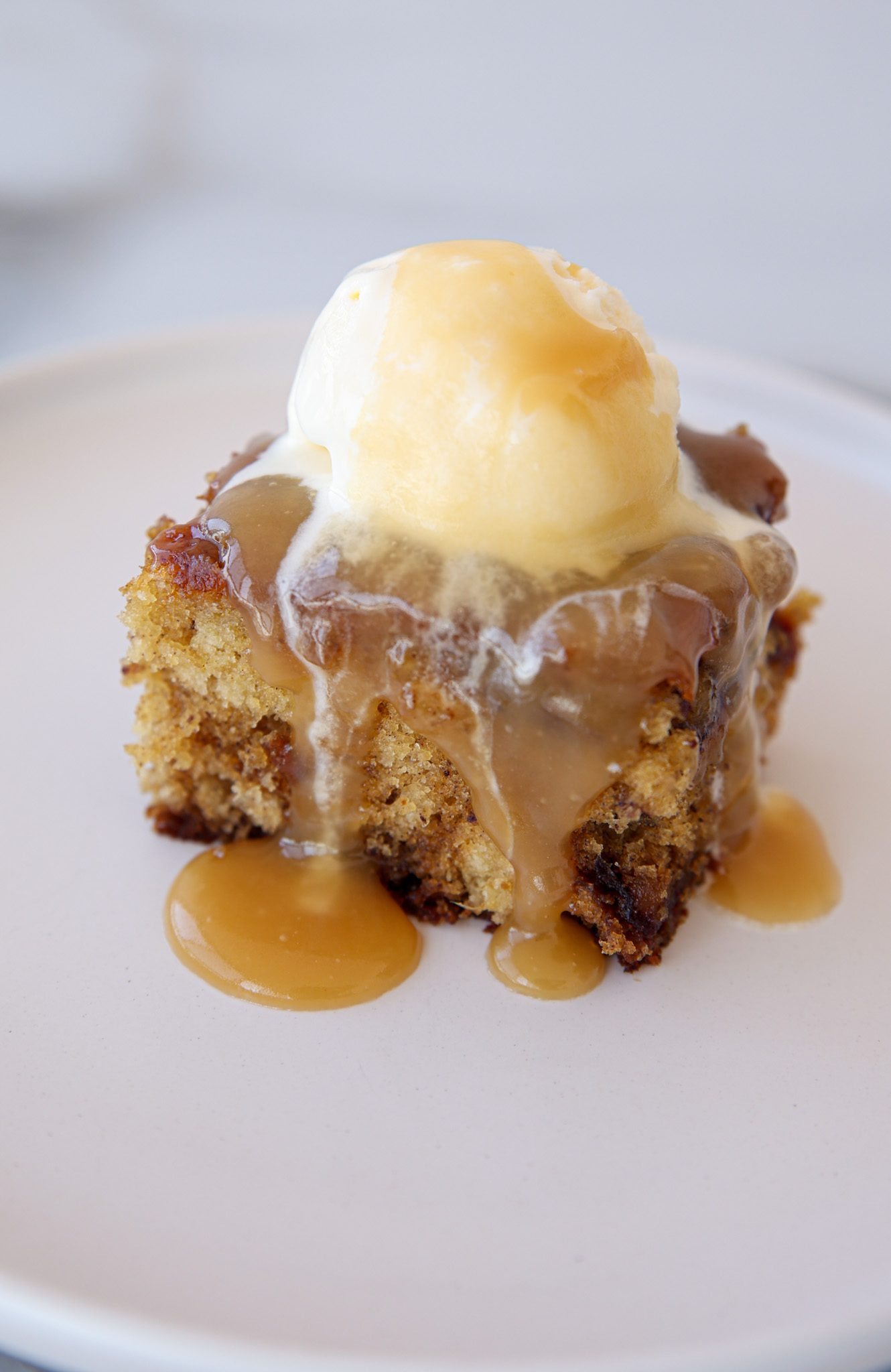 Sticky Toffee Pudding with sauce and ice cream