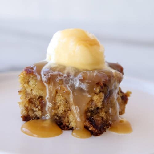 sticky toffee pudding with a drizzle of caramel sauce and vanilla ice cream