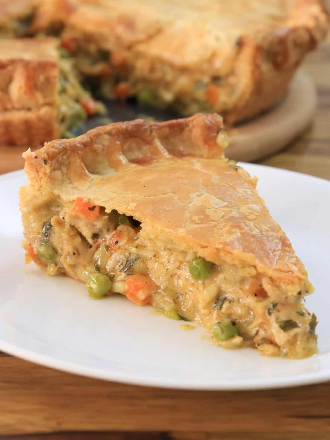 a slice of homemade chicken pot pie with double crust