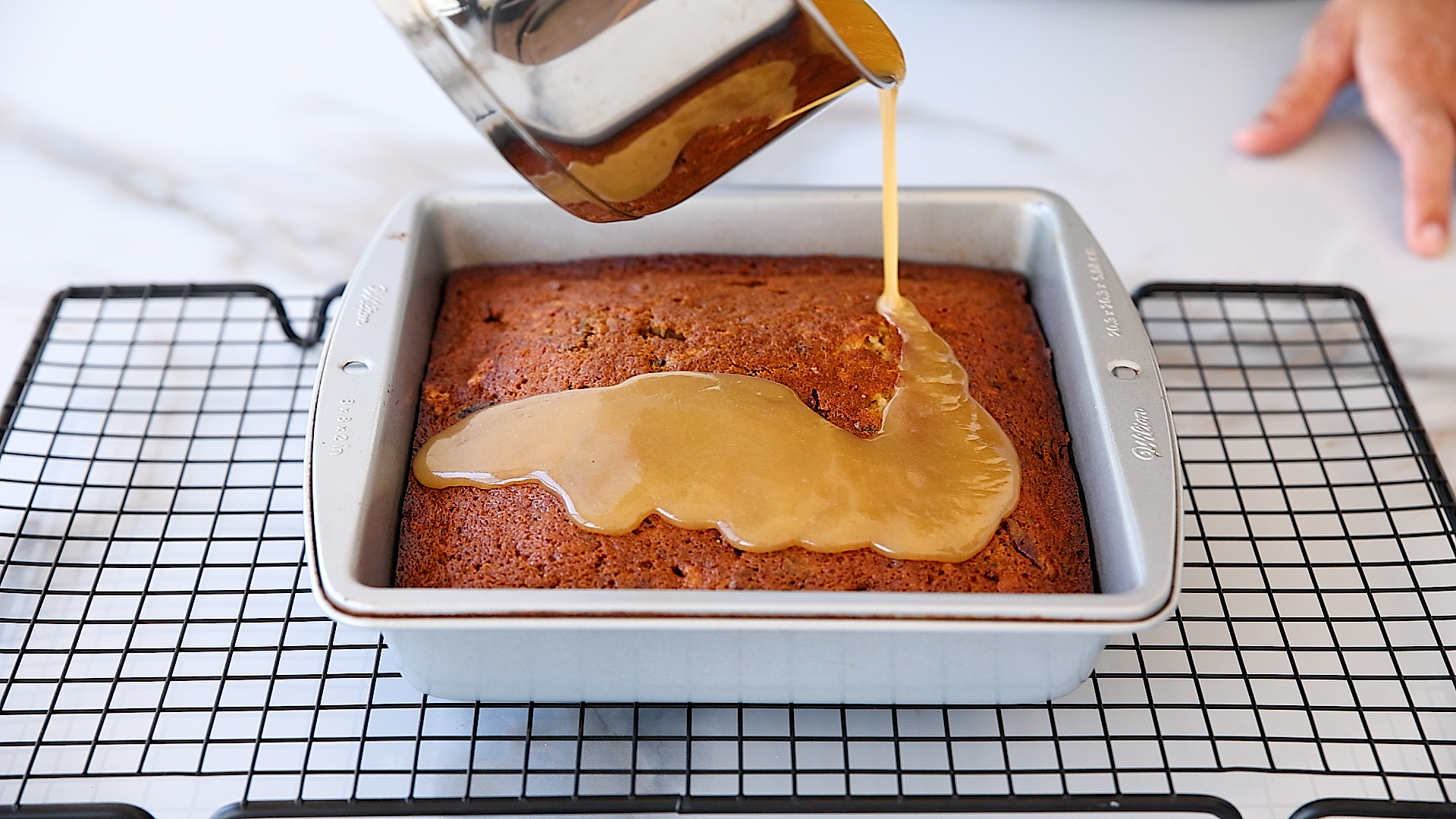 Pour half the sauce over the baked pudding for that sticky, toffee goodness