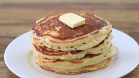 a stack of pancakes without milk with a small piece of batter