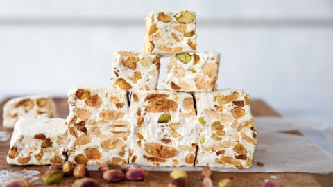 a bunch of homemade nougat squares with almonds and pistachios