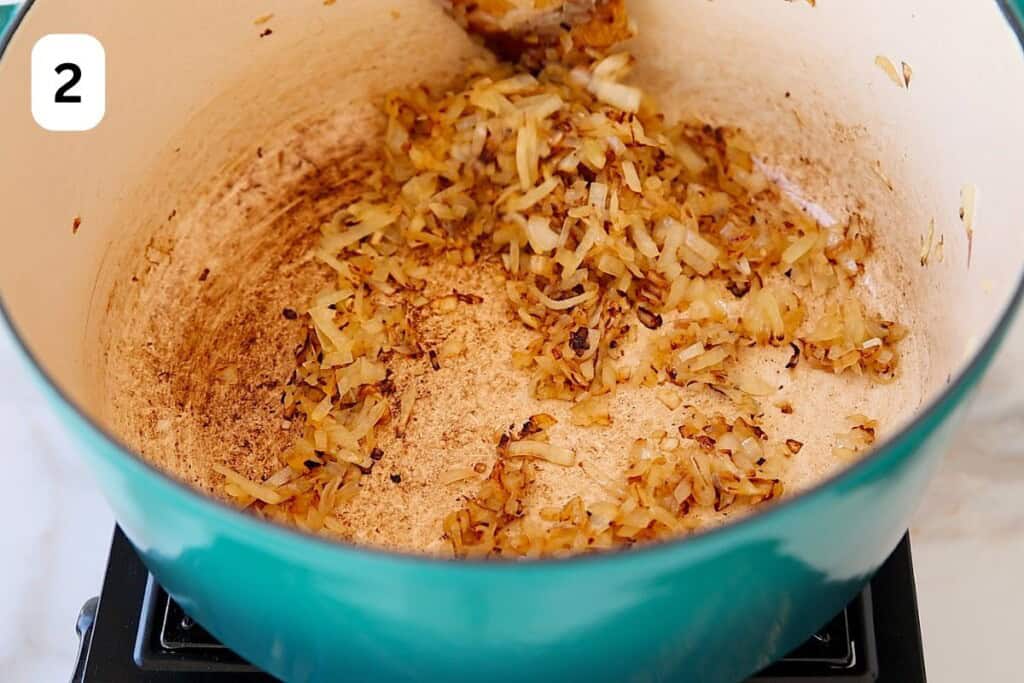 onions caramelizing in a pot.