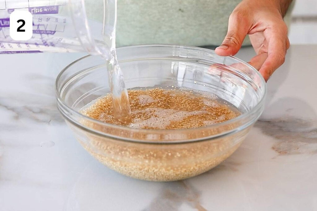 quinoa and water in a glass bowl.