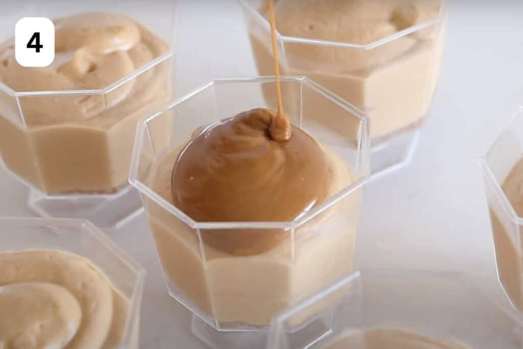 topping biscoff mousse with melted cookie spread.