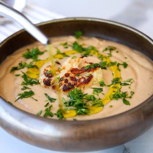 creamy cauliflower soup in a bowl.