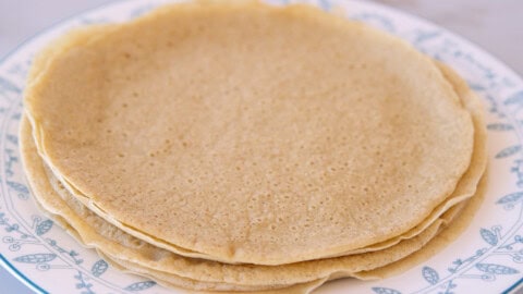 stack of gluten free quinoa crepes on a plate.